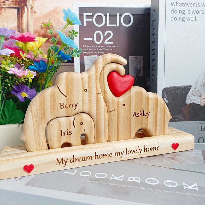 Custom elephant family plaque by Miniic Shop featuring a carved design of elephants on a wooden surface.