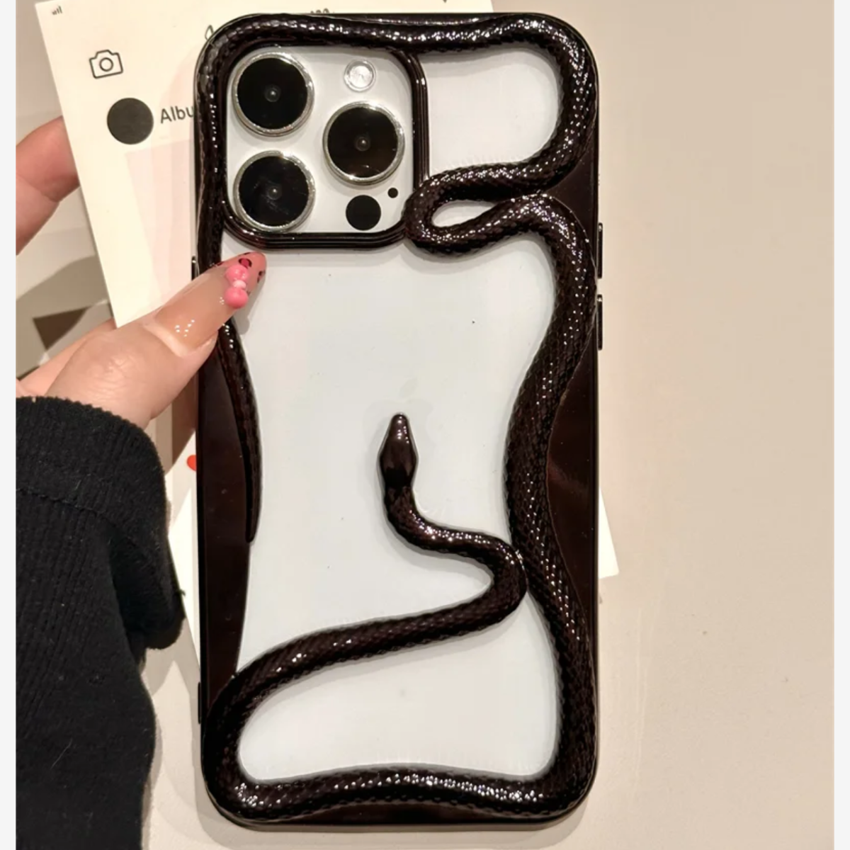 Miniic Shop 3D Snake Hollow phone case showing a slim, textured design with a hollow snake pattern on a smartphone.