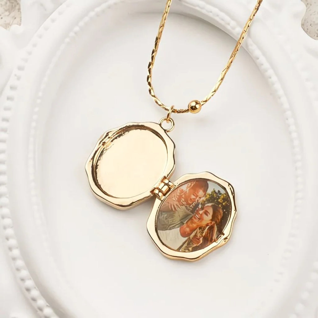 Custom photo angel locket necklace from Miniic Shop featuring a silver pendant with a photo insert and decorative angel design.