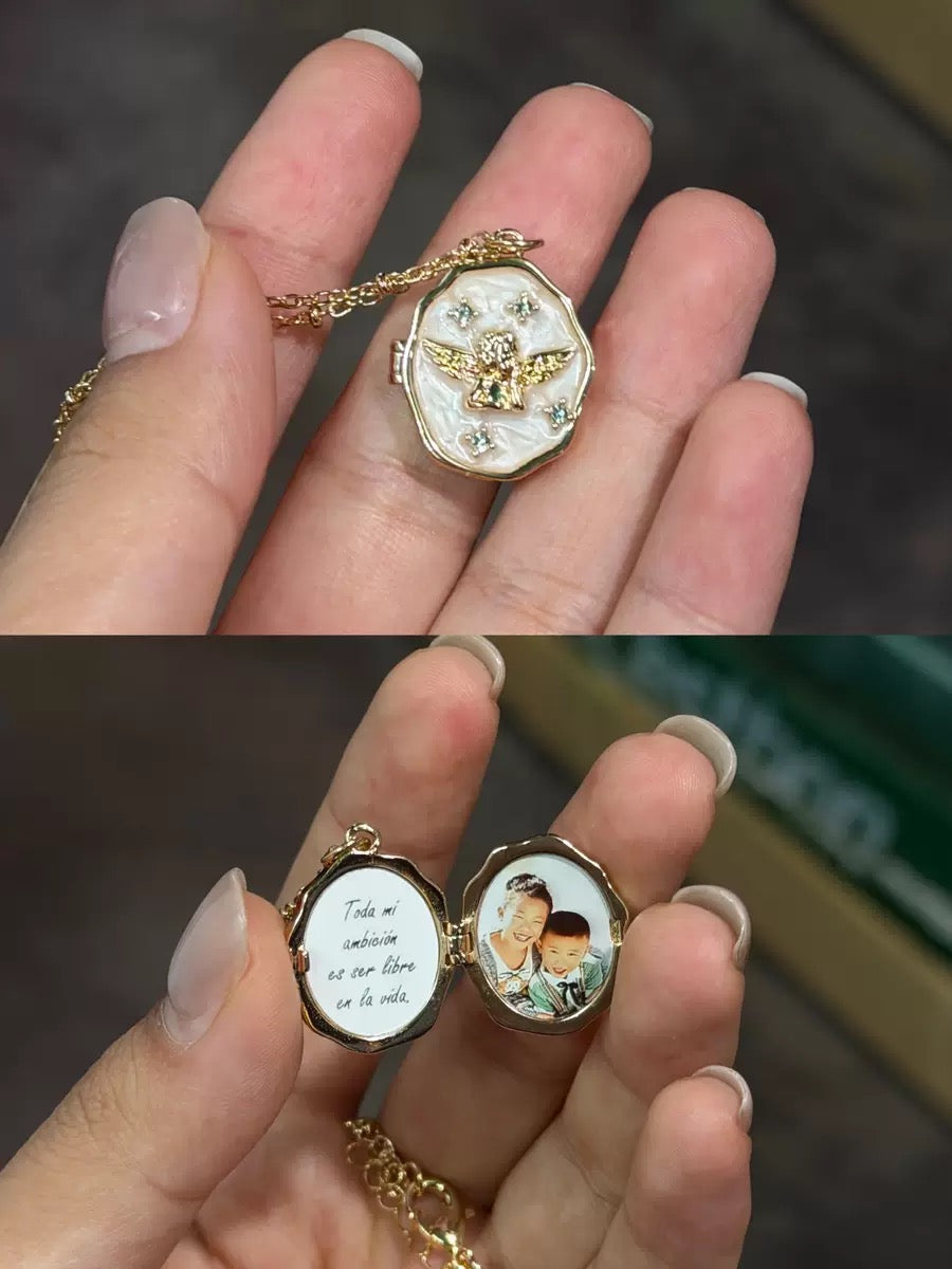 Miniic Shop custom photo angel locket necklace with a silver pendant and engraved angel design, showcasing a personalized jewelry piece.