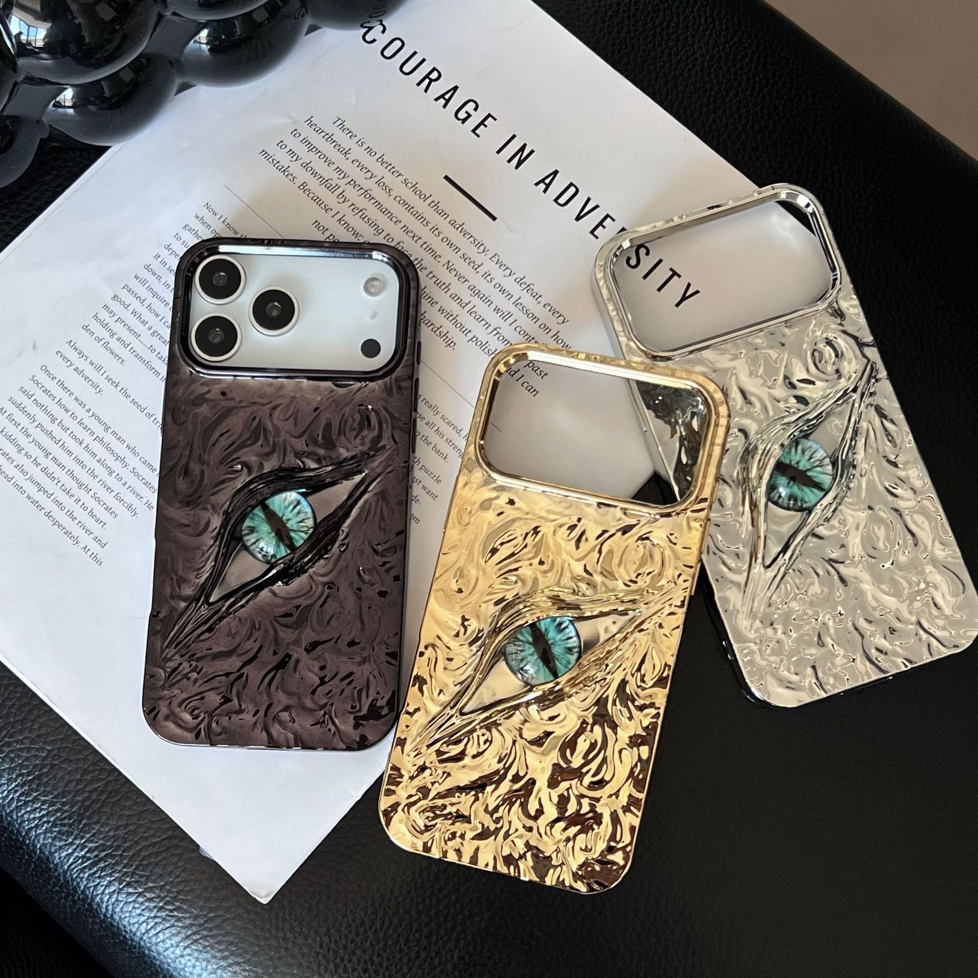 Miniic Shop 3D Evil Eye textured phone case with shockproof design, featuring vibrant blue and black eye pattern for iPhone or Android.