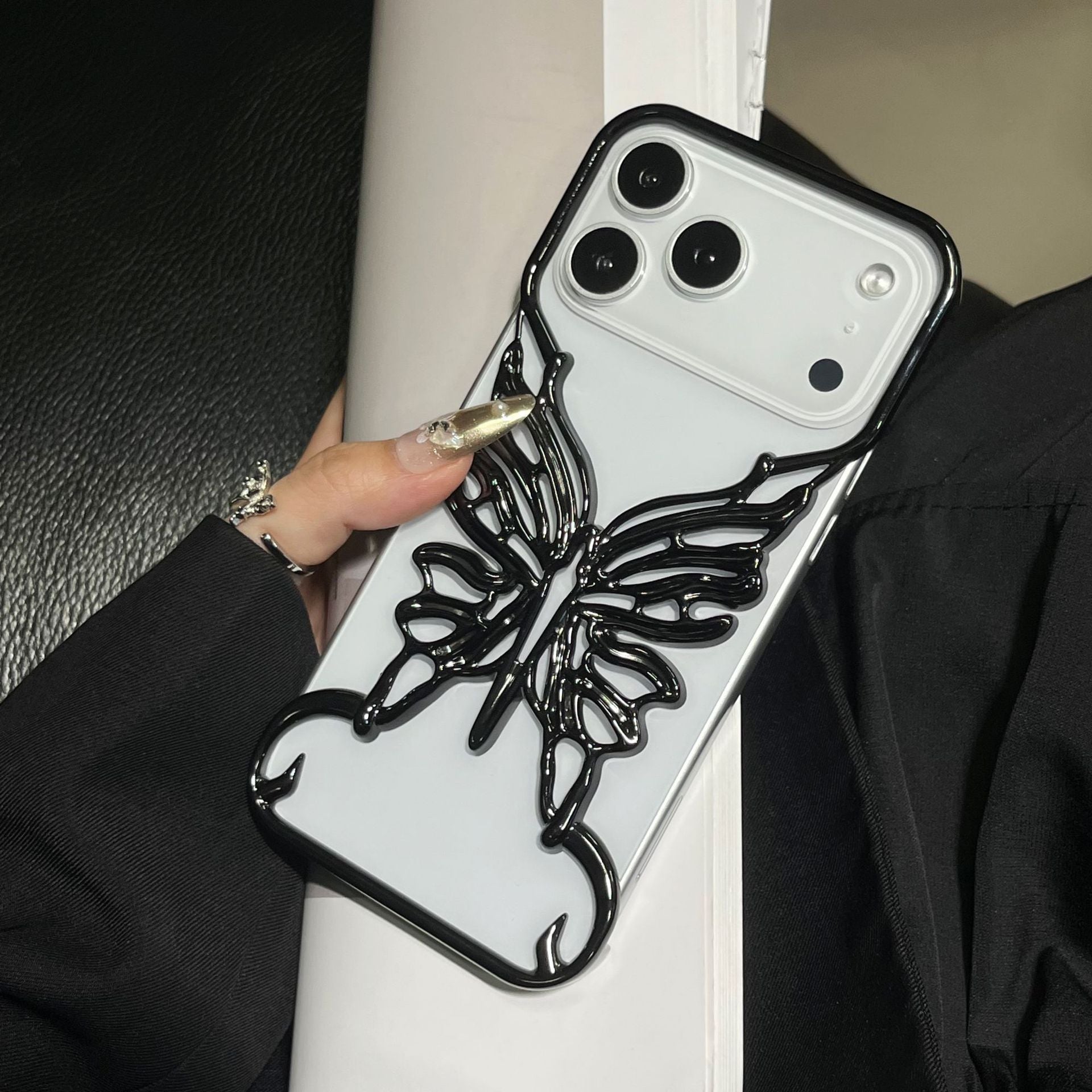 Miniic Shop 3D butterfly phone case with hollow out design, showcasing intricate butterfly and floral patterns on a protective cover.