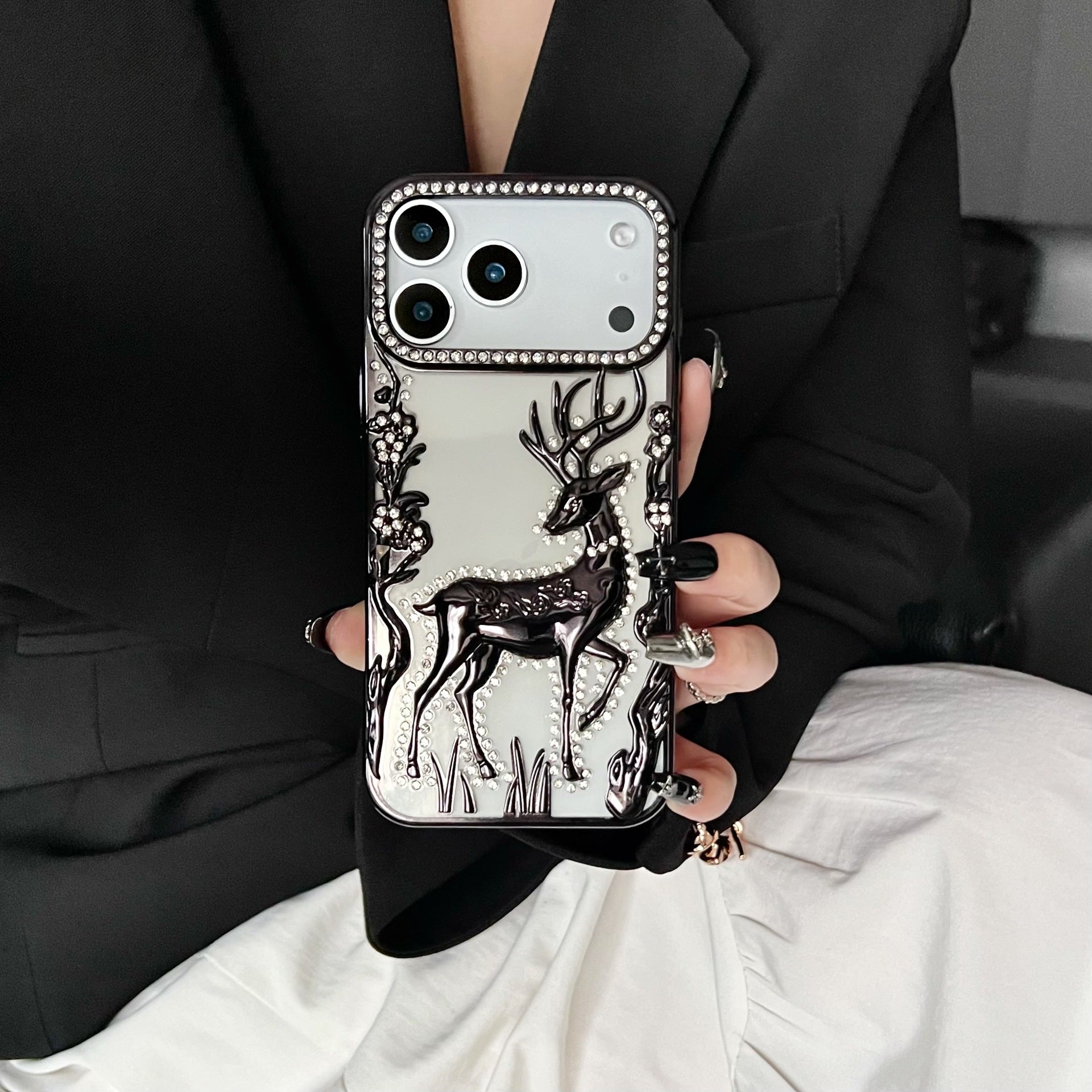 Gold 3D Elk Hollow phone case by Miniic Shop, electroplated protective cover with intricate elk design on a smartphone.