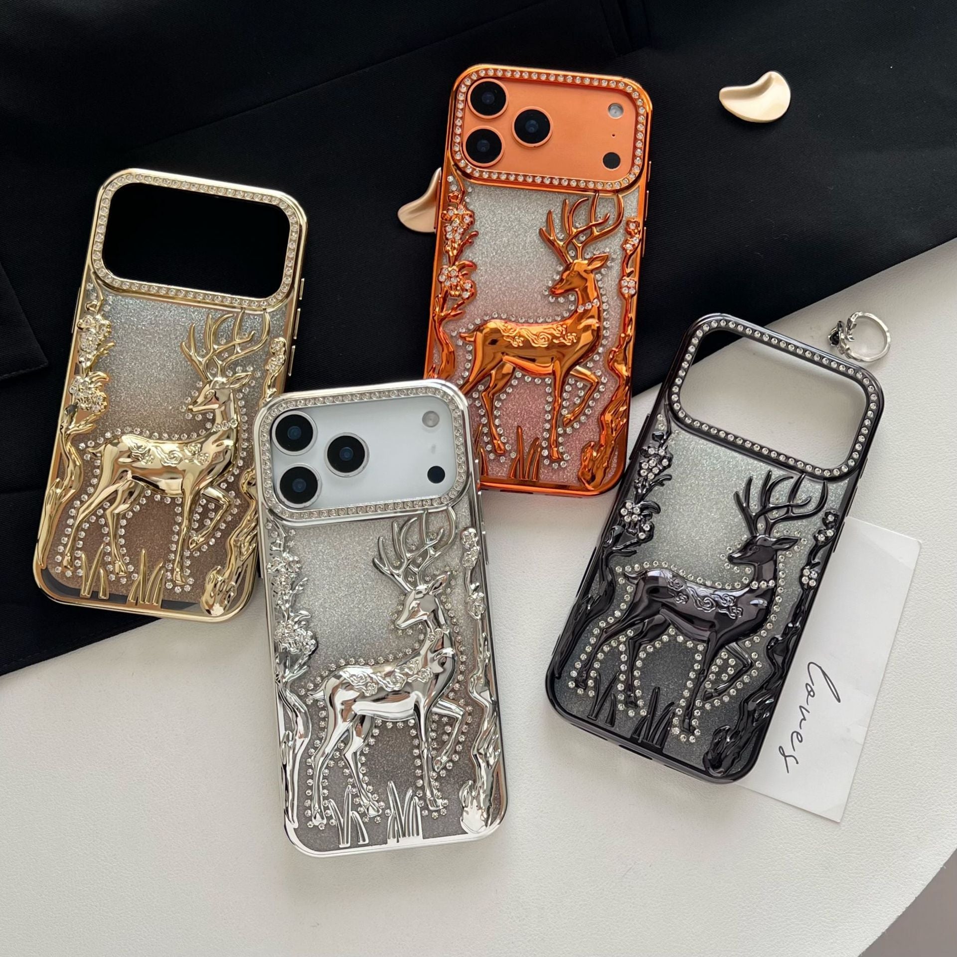 Gold 3D elk hollow phone case by Miniic Shop, electroplated protective cover with intricate elk design for iPhone.