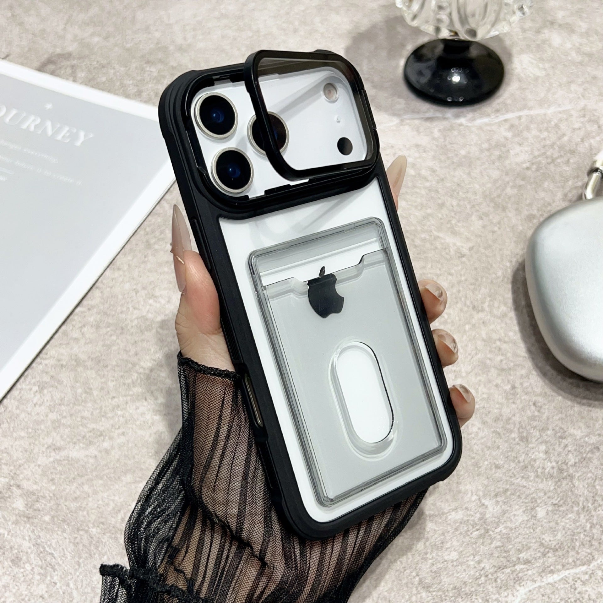 Clear Miniic Shop iPhone case with card slot and kickstand, showing snug fit and transparent design for easy access and protection.