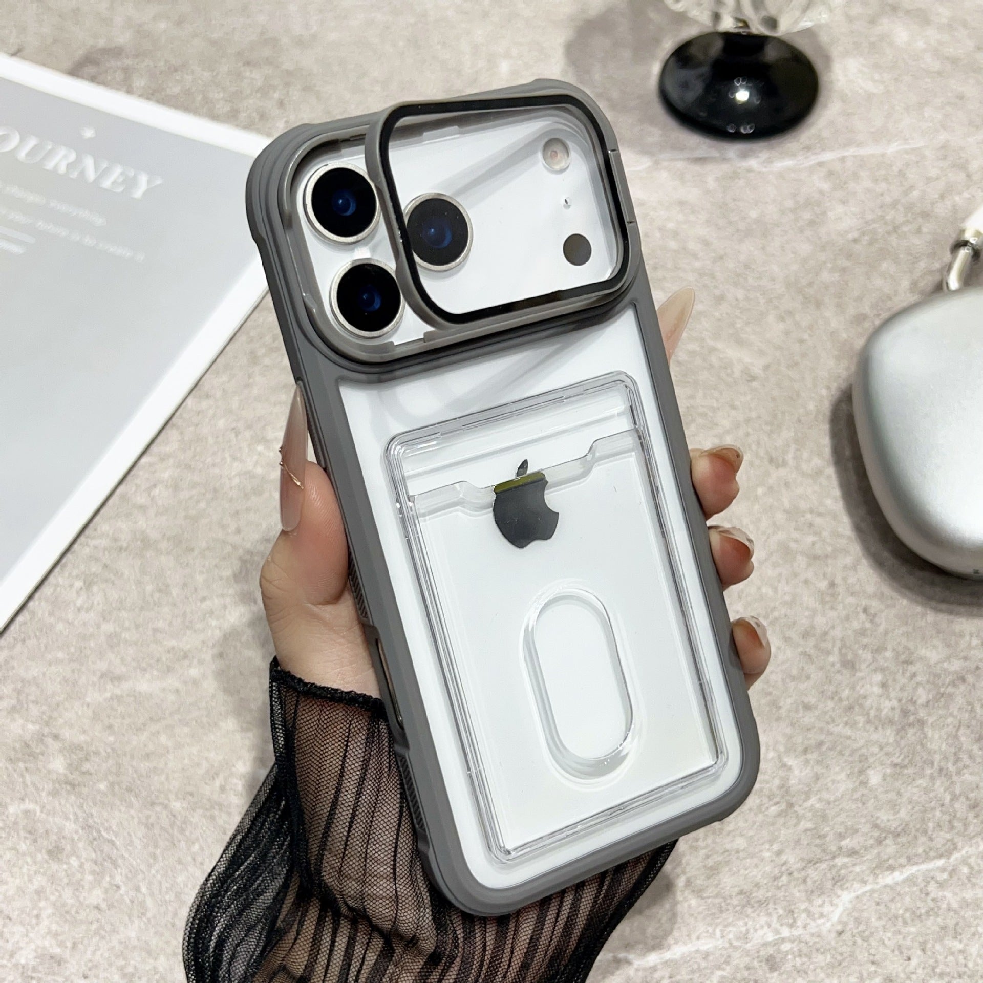 Clear Miniic Shop iPhone case with card slot and kickstand, showing the transparent design and functional features.