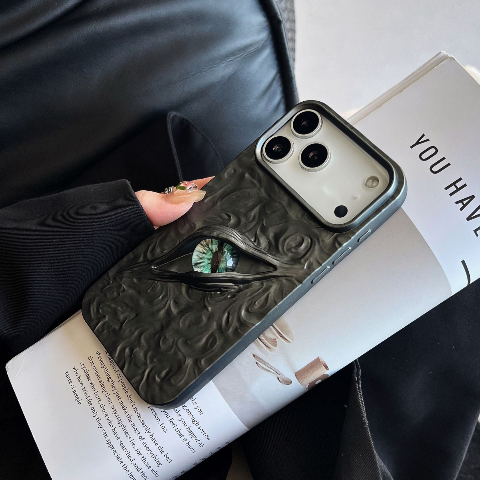 3D evil eye textured phone case by Miniic Shop, shockproof aesthetic cover with vibrant blue and white eye design.