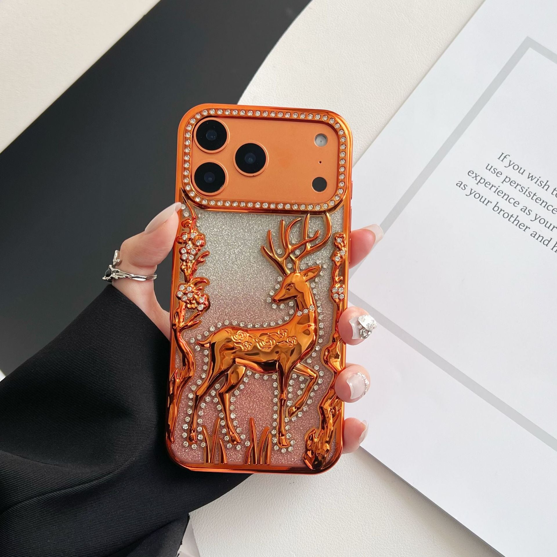 Gold 3D Elk Hollow phone case by Miniic Shop with electroplated finish, featuring a detailed elk design for iPhone protection.