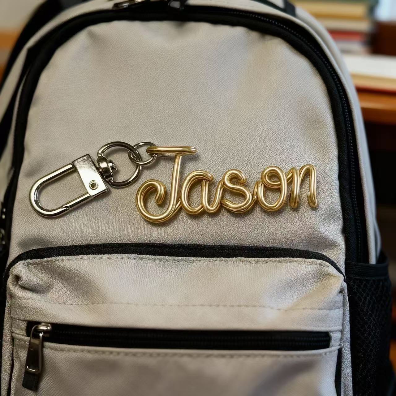 Personalized hand-bent wire name pendant with custom alphabet letter charm for bags, phones, or keychains by Miniic Shop.